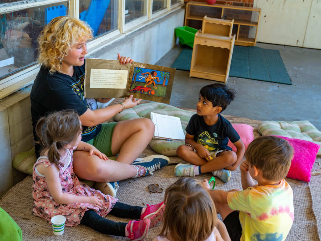 Stock imagery of staff and student teachers interacting with children at the North Drive location of the UNCG Child Care Education Program.