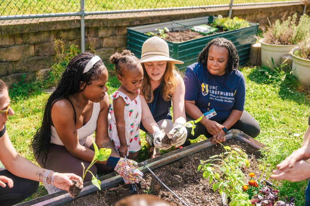 Farm to ECE staff works with children and teachers at UNCG North Drive Child Care Center