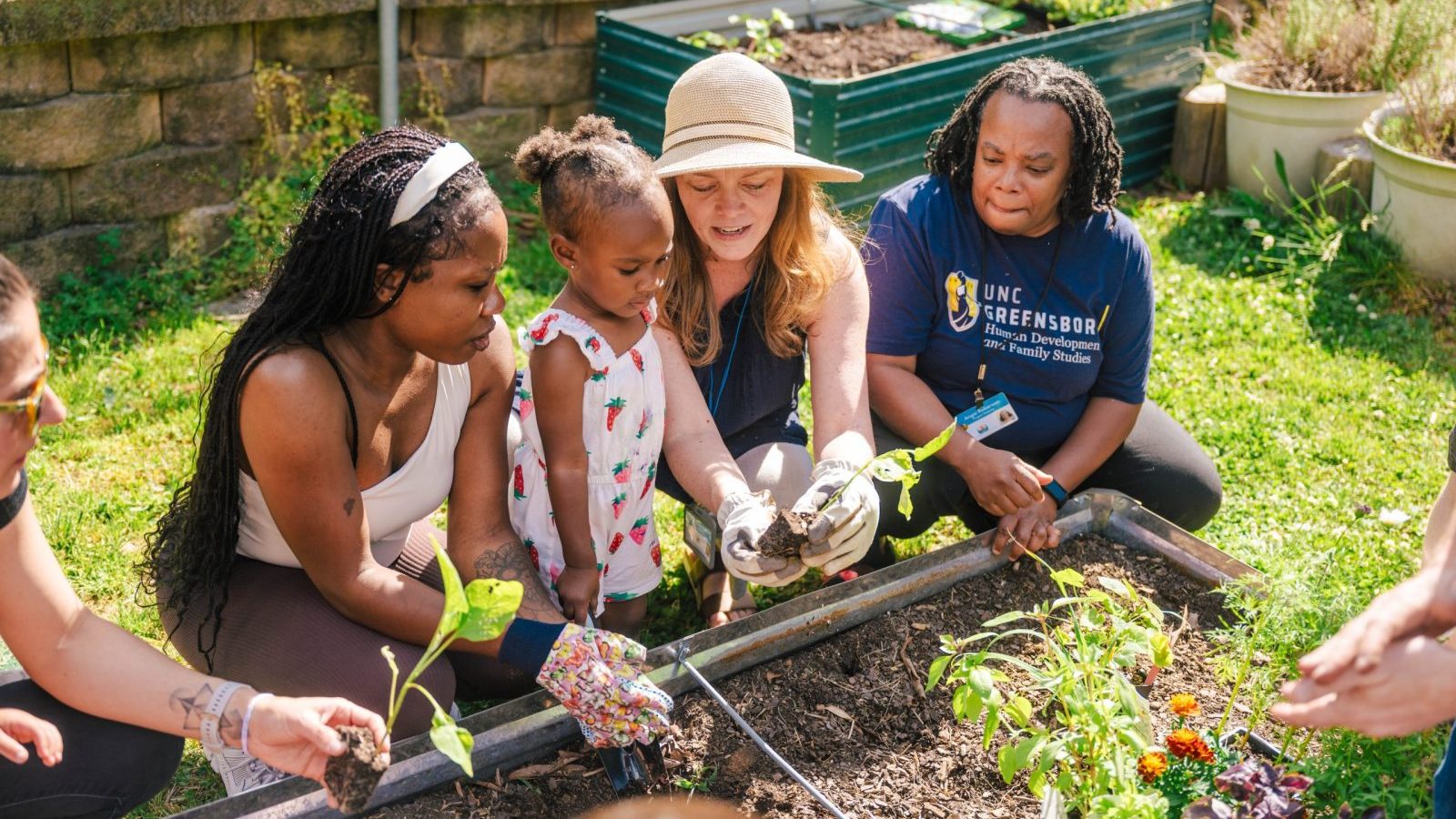 Farm to ECE staff works with children and teachers at UNCG North Drive Child Care Center